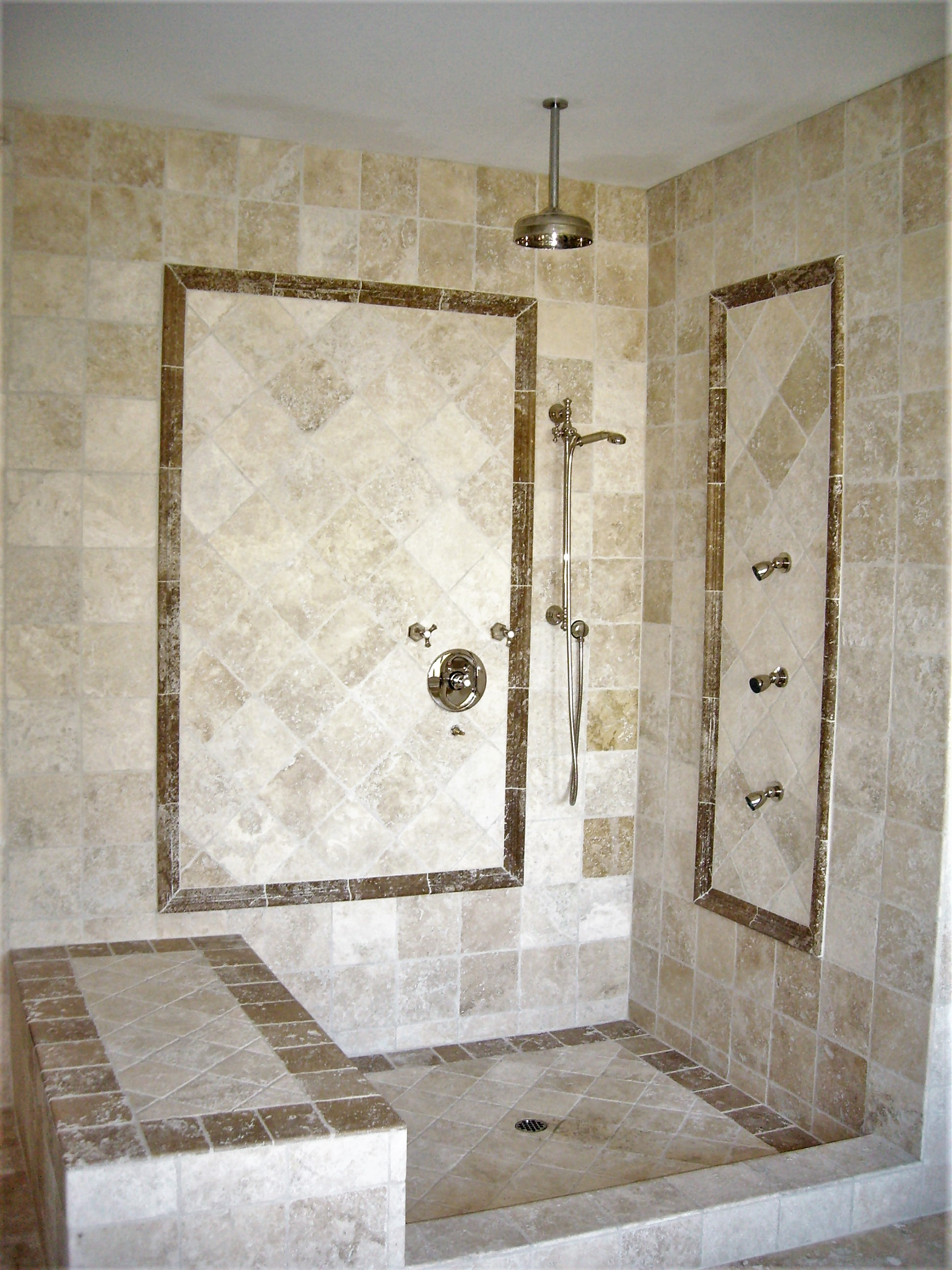 shower design, natural stone, shower seat, shower damn