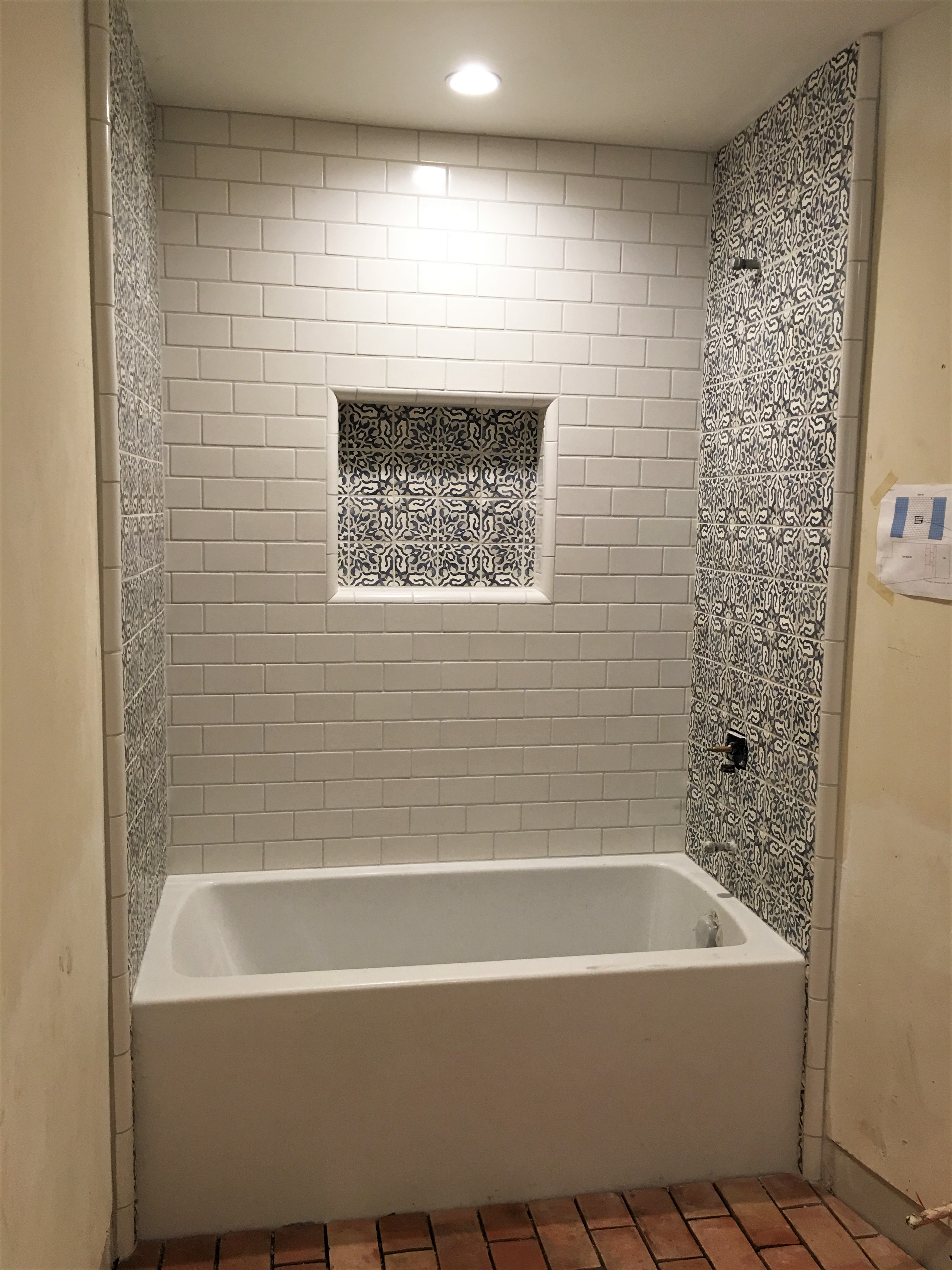 Spanish style tile custom shower design, niche