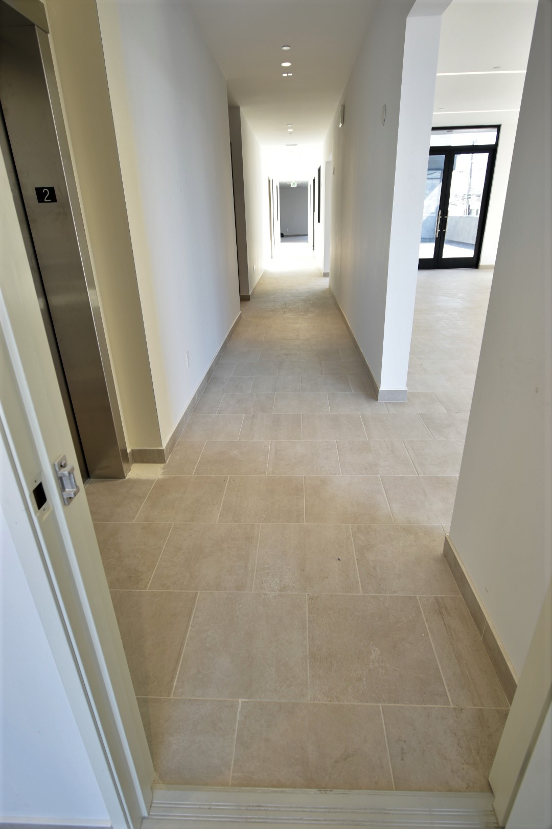 commercial work, tile floor, baseboards, grout